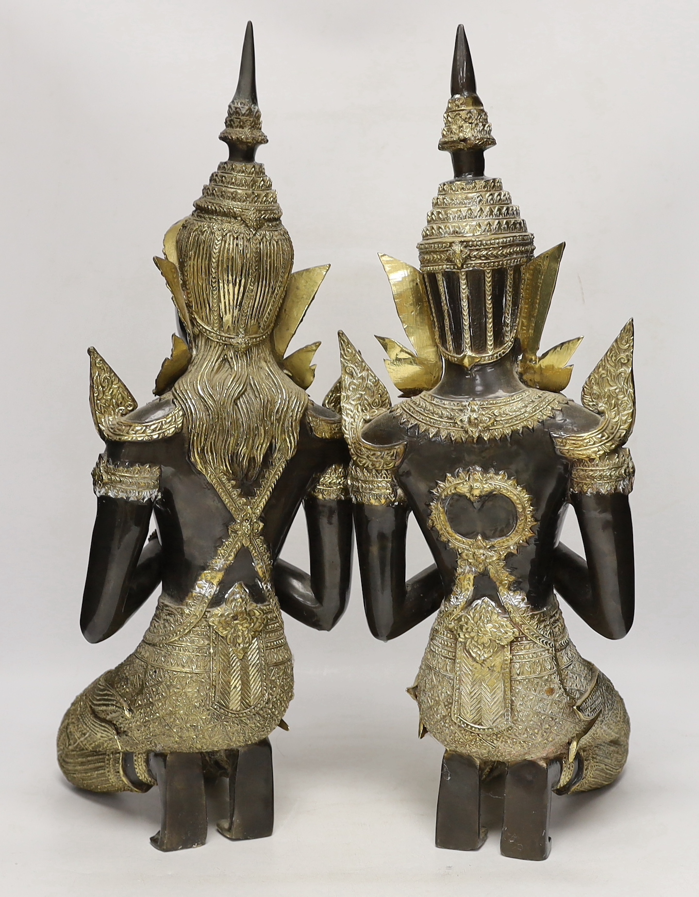 Two 20th century gilt decorated metal models of 'Thai Buddhas', 54 cm high
